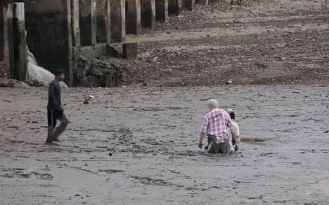 Fisherman’s Saved Two Strangers Trapped In Waist-High Mud