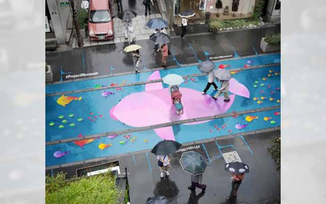 These Colorful Street Murals Of Fish Show Up Only When It Rains