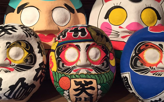 Japanese Graffiti Artist Combines Street Art With Traditional Daruma Dolls