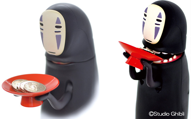 Cat Watches In Shock As No-Face Piggy Bank Swallows Up Coins