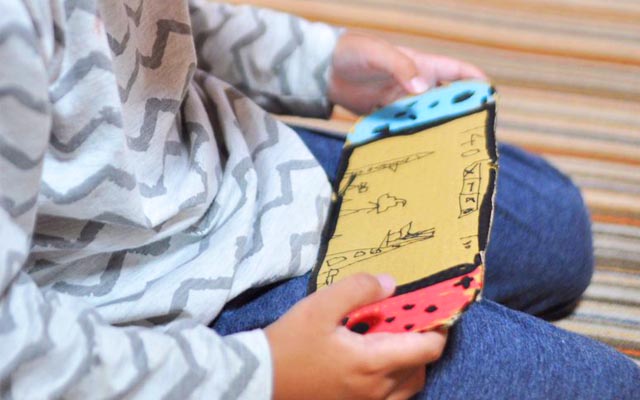 Patient Kid Makes Do With Cardboard Nintendo Switch, Until His Dad Pulls A Touching Switch Of His Own