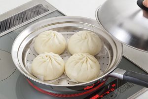 Instantly turn your pans and pots into steamers with this convenient steamer plate from Japan