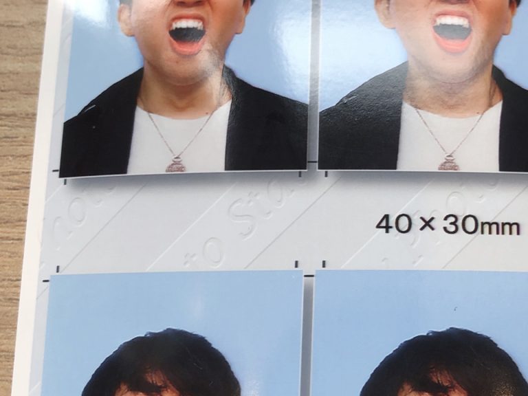 Japanese man posing for ID photo sneezes with hilarious results