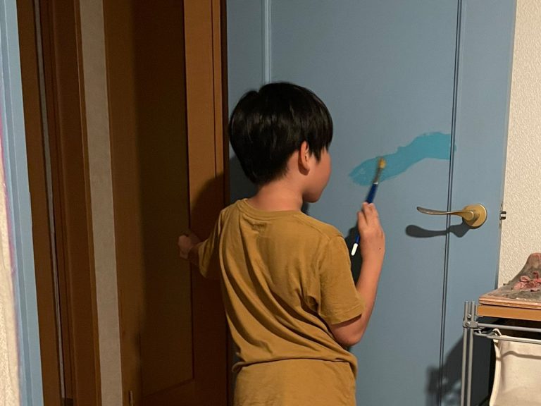 Elementary school boy paints his room, turning it into an ocean paradise