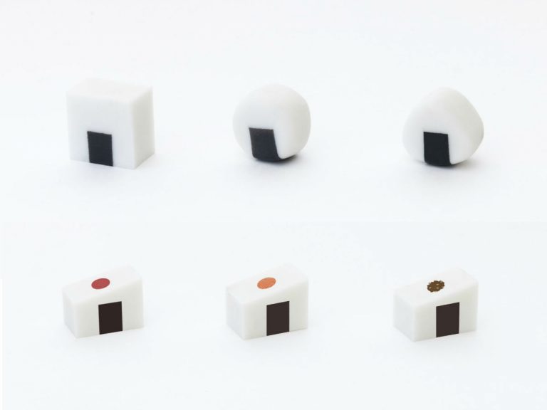 Adorable rice ball erasers round out and reveal their filling with every mistake you make