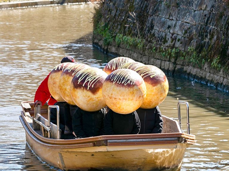 Boat of giant takoyaki sails down river in Japan, wowing locals