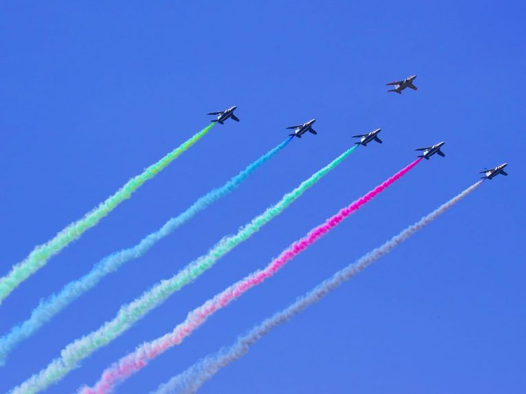 Japan’s Blue Impulse aerobatic team skywrites colorful Olympic rings over the skies of Tokyo