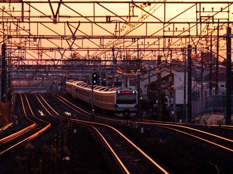Japanese photog captures sunset silhouettes of electric wires, train tracks & other infrastructure