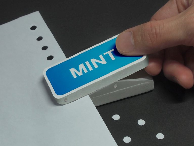 Designer’s awesome hole punch pops out paper as “mints”