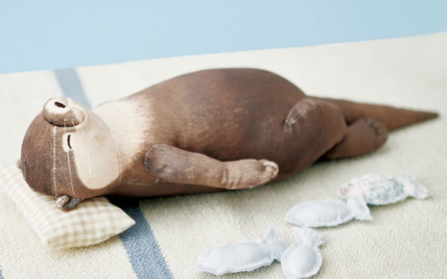 Adorable Slumbering Otter Pouch From Japan Has A Tummy That Doubles As An Arm Rest