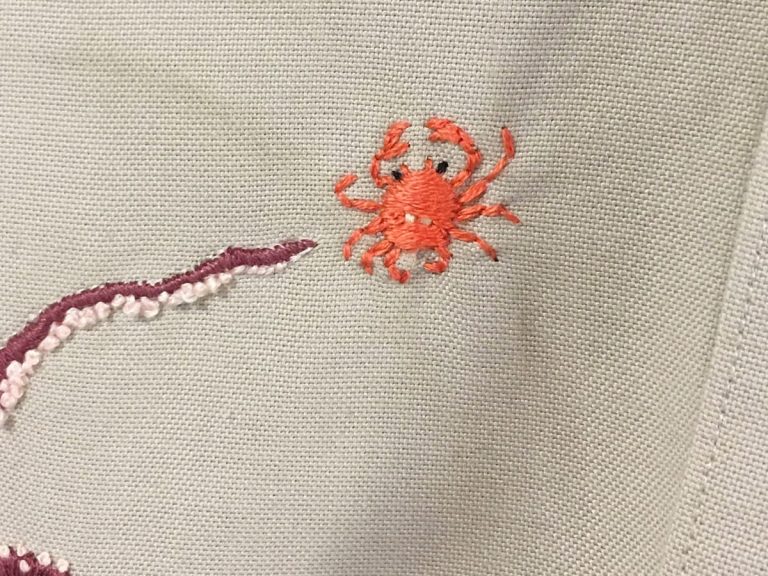 Swim little crab, swim! Japanese hobbyist stitches a dramatic ocean scene on a Muji shirt