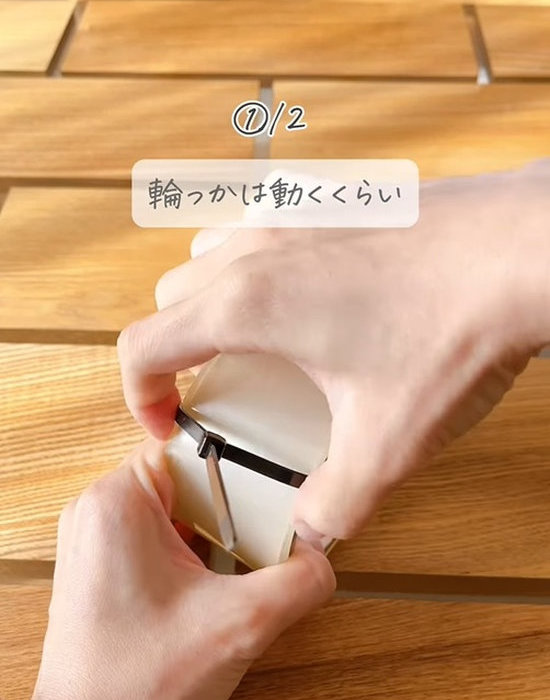 OPPテープに結束バンドを取り付けている様子