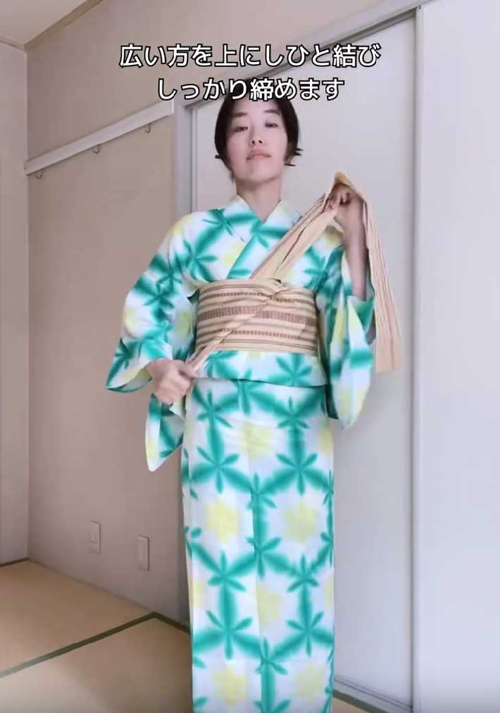 帯を締める