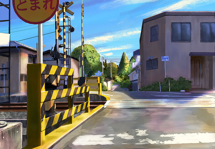 踏切と住宅街を描いたイラストの写真
