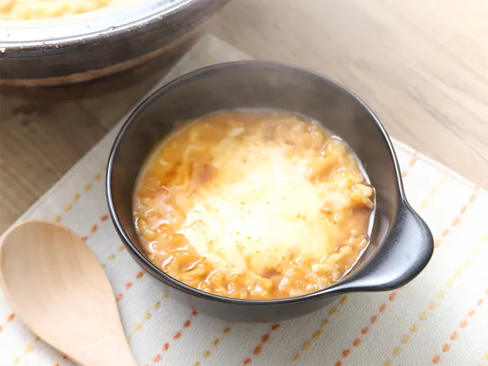 〆のキムチチーズリゾットの写真