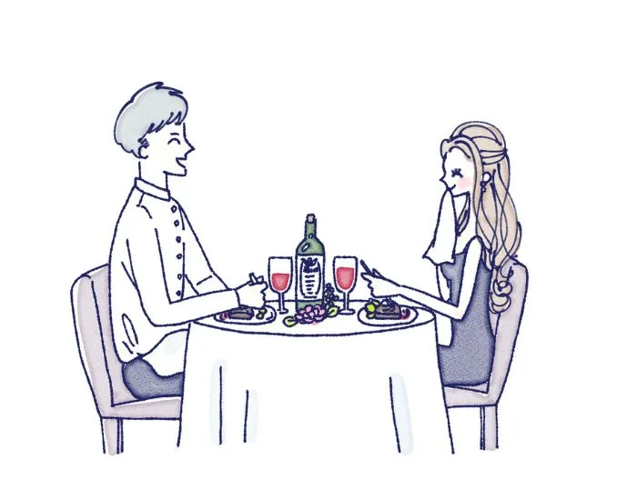 レストランでディナーをしているカップル