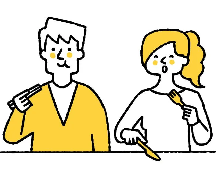 レストランで食事をするカップル