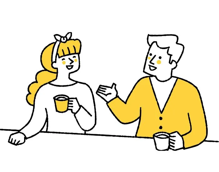 コーヒーを飲みながら談笑するカップル