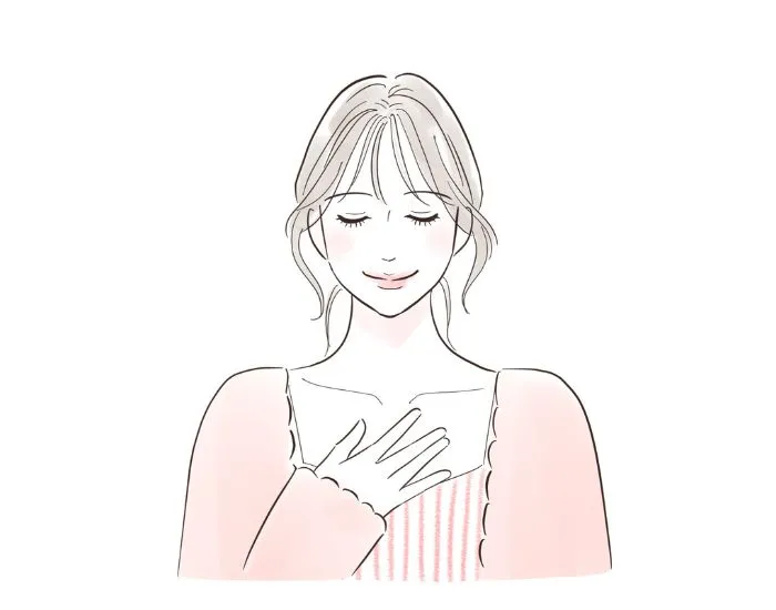 胸に手を当てる女性