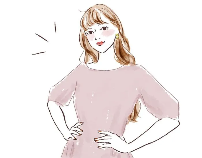 腰に手を当てている女性