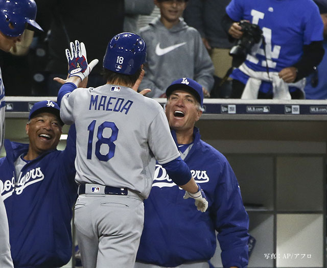 Los Angeles Dodgers starting pitcher Kenta Maeda is congratulated by manager Dave Roberts, left, and coach Bob Geren after hitting a solo home run against the San Diego Padres in the fourth inning of a baseball game Wednesday, April 6, 2016, in San Diego. (AP Photo/Lenny Ignelzi)