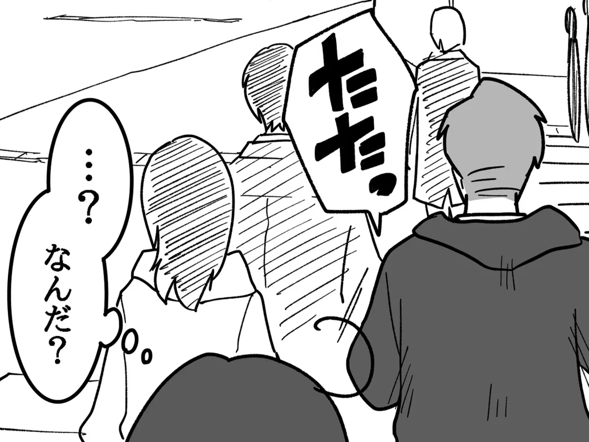 通勤途中のサラリーマンが描かれた漫画の写真