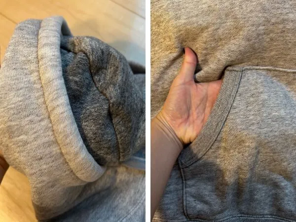 グレーのパーカーの湿り気を確認している様子